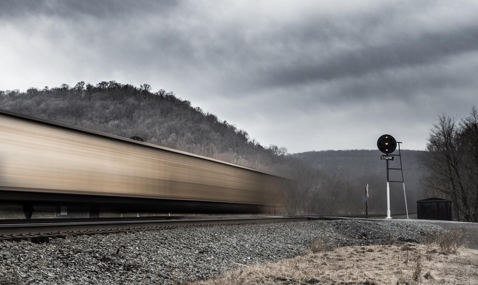 The end of an eastbound coal train passes the intermediate position signals in Horningford, PA.