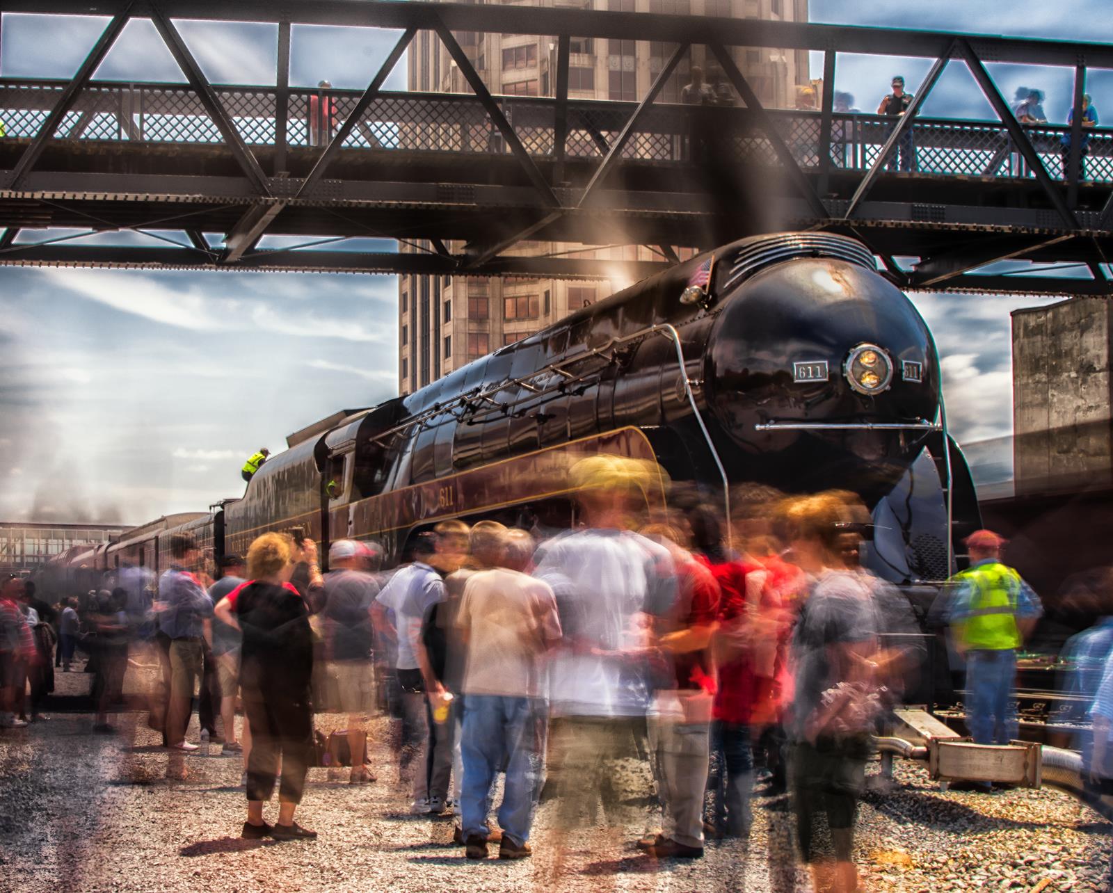 N&W Class 611 arrives into Roanoke while a crowd of fans surround the streamlined engine.