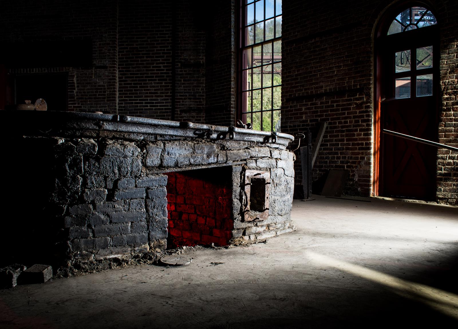 Artifacts of the Smith Shop of the former Bethlehem Steel Plant are examined.  The property now belongs to the Center of Metal Arts.