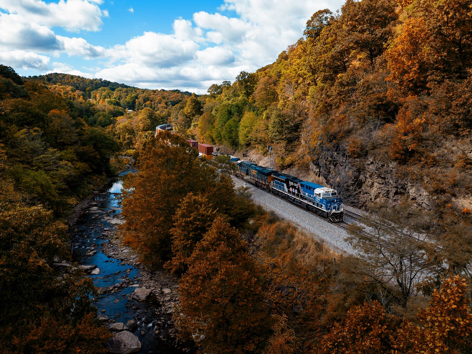 The Spirit of Law Enforcement, CSX 3194, passes through Fairhope, PA on its trip towards Cumberland, MD. 

The Sand Patch grade through the Allegheny Mountains is filled with colorful foliage during early Autumn. Fairhope is particularly scenic as the tracks parallel Wills Creek.